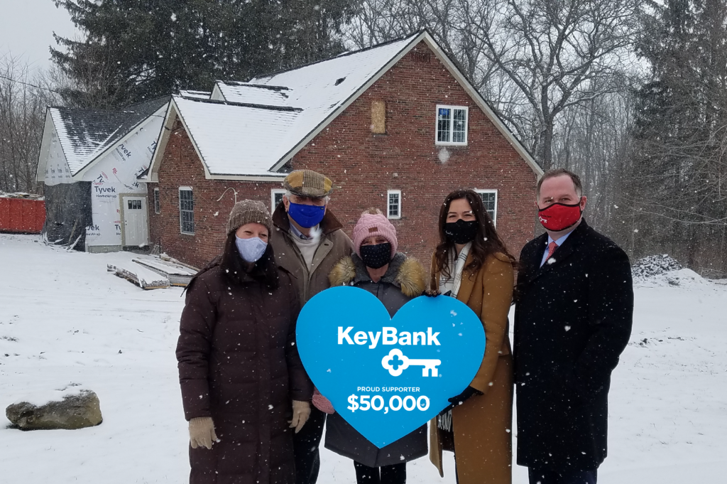 KeyBank press photo in front of The Star Hospice House